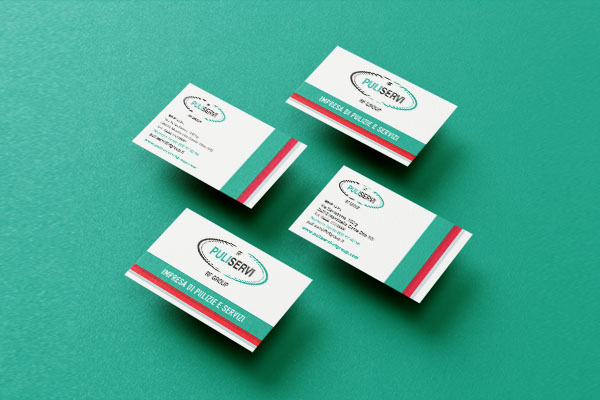 biglietto da visita per impresa di pulizie industriali appoggiato su tavolo con fondo verde