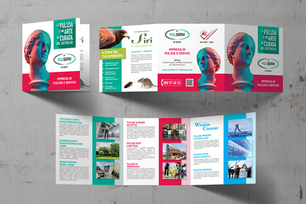 biglietto da visita per impresa di pulizie industriali appoggiato su tavolo con fondo verde